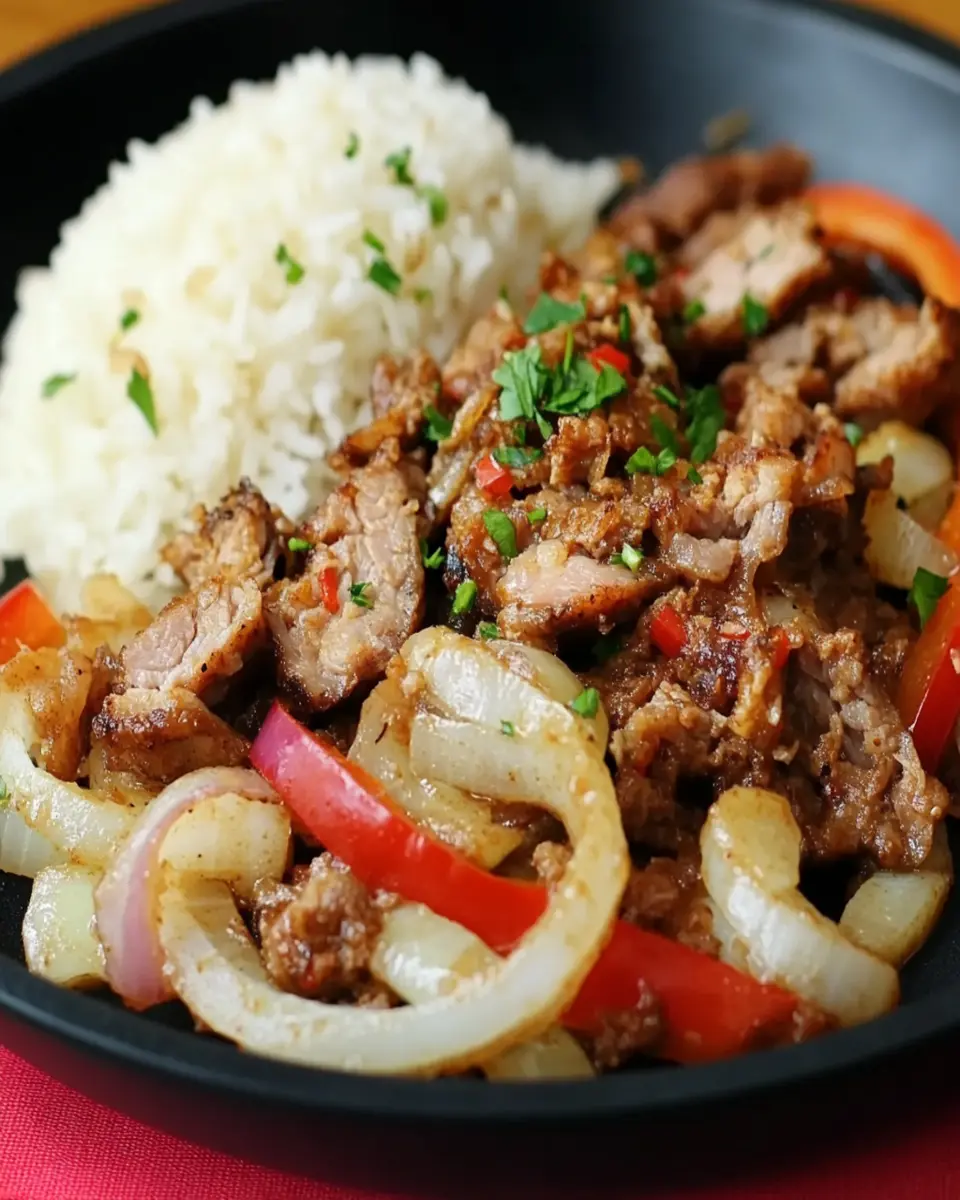 Filipino Sizzling Pork with Garlic Rice: Irresistibly Juicy Delight
